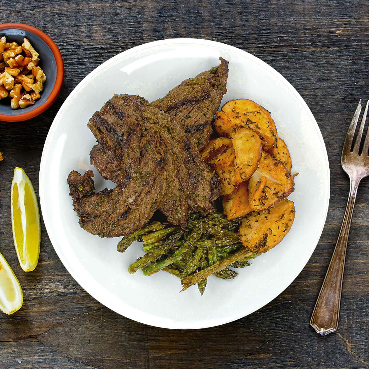 House Marinated Steak Tips with Herbed Potatoes & Asparagus